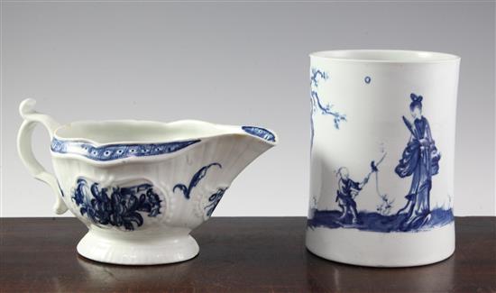 A Worcester blue and white a walk in the garden pattern mug, c.1758 and a strap flute floral pattern sauceboat, c.1775, height 14cm (